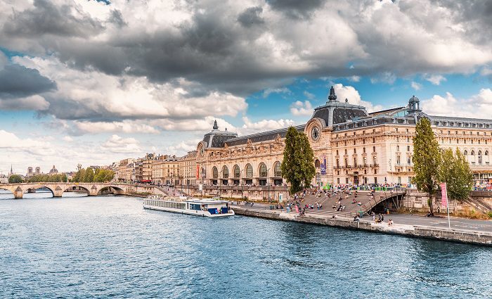 Exterior view of the Musee d'Orsay in Paris with the river in the foreground
